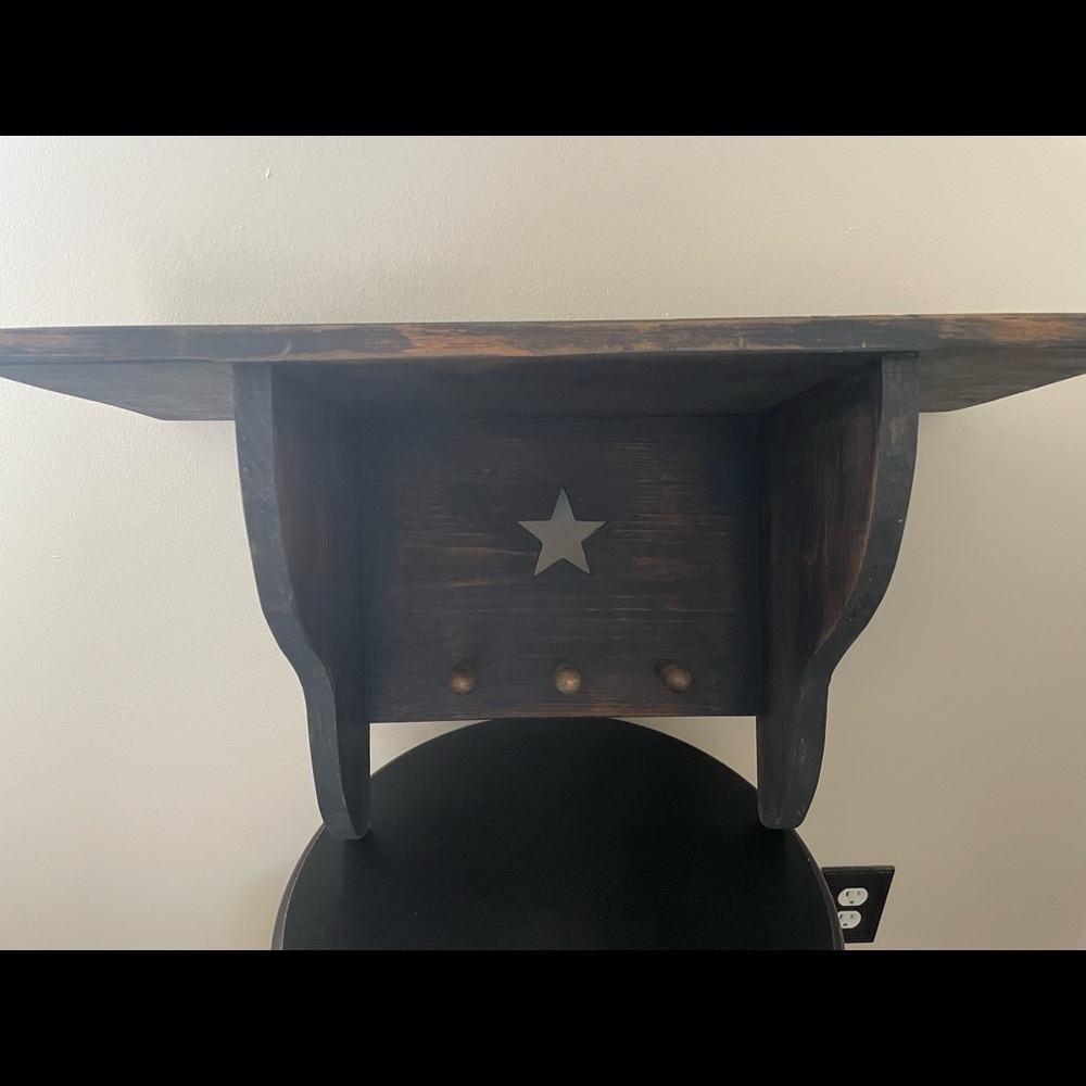 Primitive navy shelf. 24 1/2 inches long and 16 1/2 high. shelf ledge is 9 1/2 w